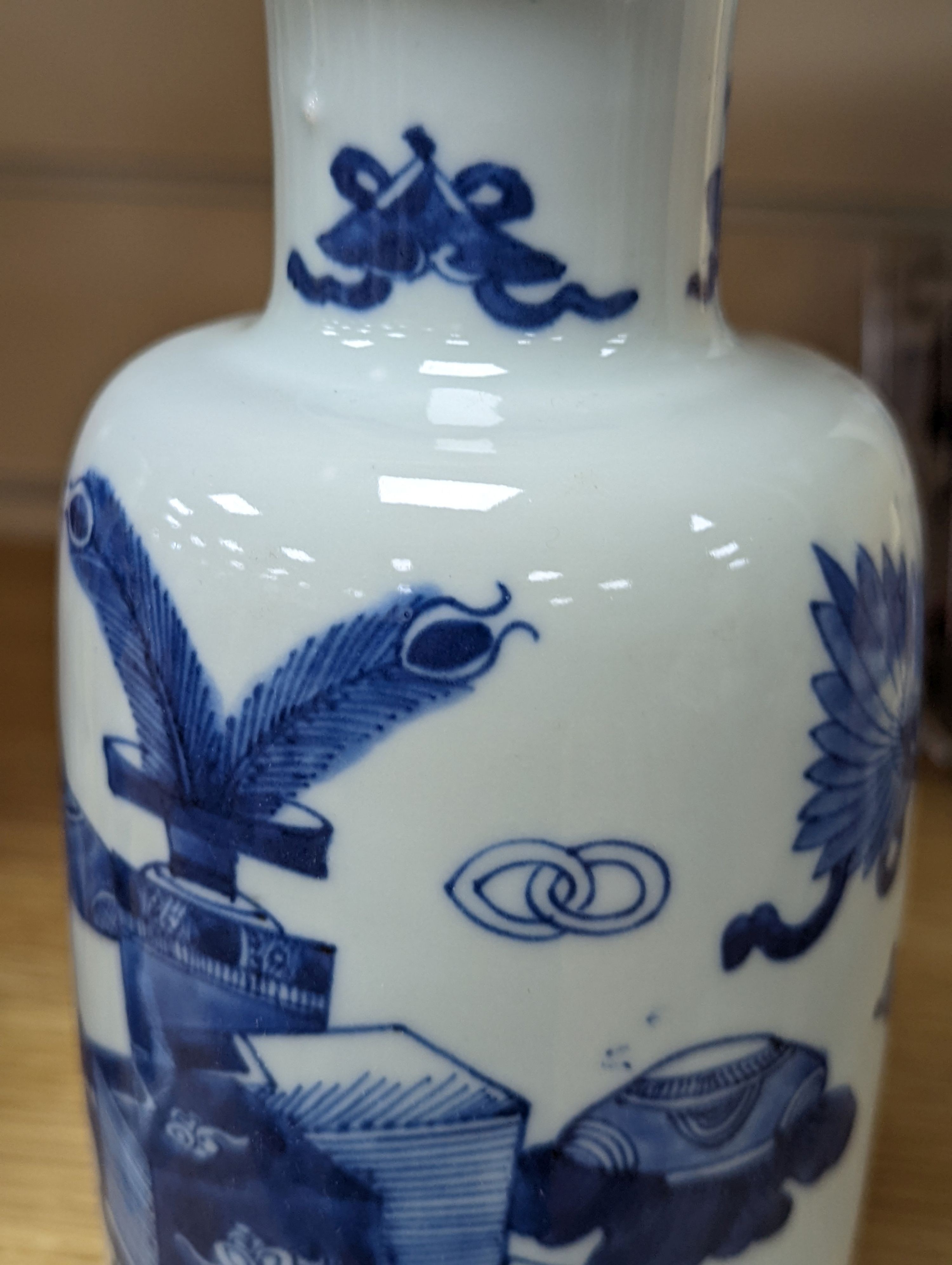 A Chinese blue and white ‘Antiques’ vase, 19.5 cms high.